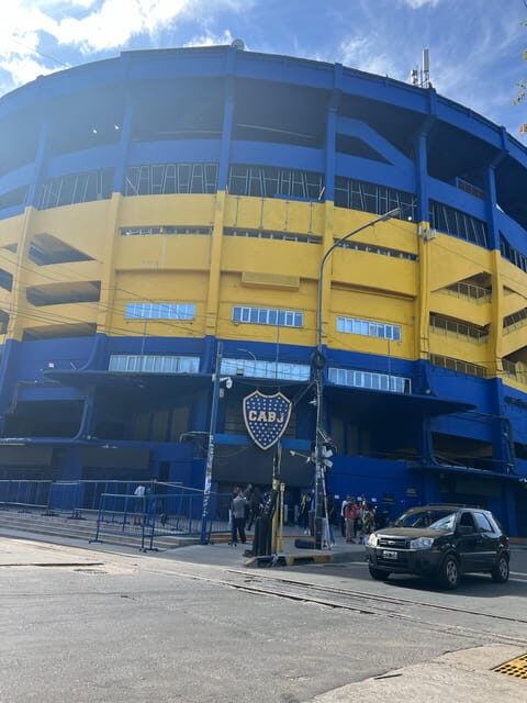 Walking Tour of San Telmo and La Boca with local food - The Maradona Themed Bar Finish: Drink + Souvenir Cup